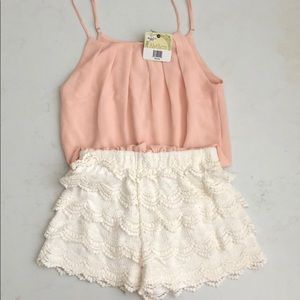 Alythea pink and white romper size medium